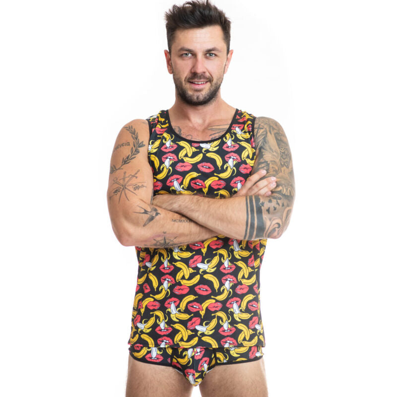 A man wearing a yellow and red banana print lycra tank top. Anais Men Banana Top soft lycra men's lingerie top with bold banana print
